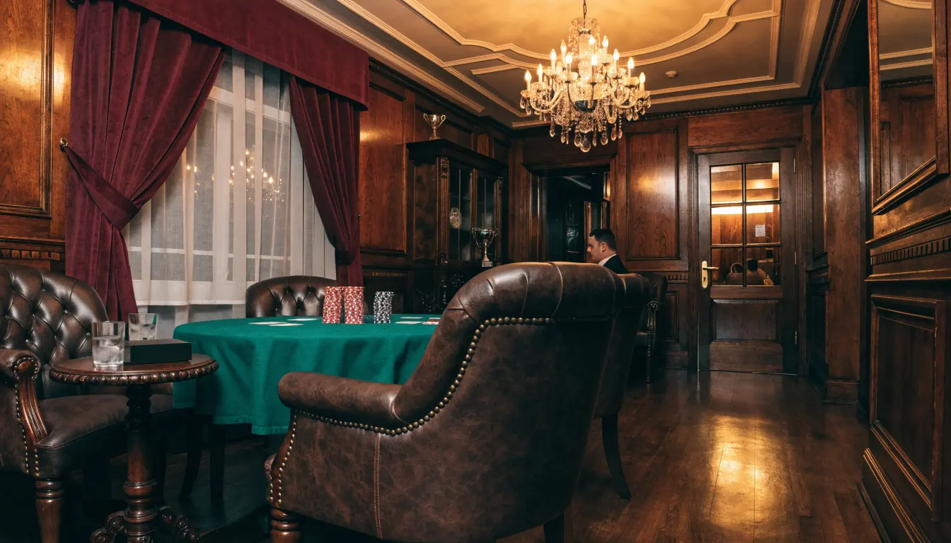 Private VIP gaming salon in a London club with chips and cards on felt table